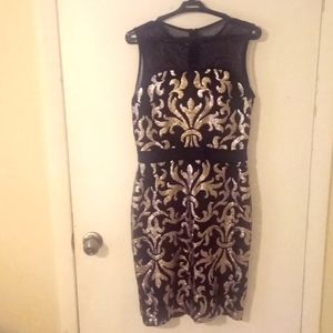 Woman's formal dress. Black with Gold embroidery. Size 6.